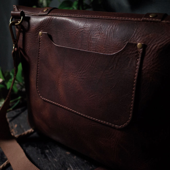 Sleek chestnut brown leather shoulder bag perfect for work and travel
