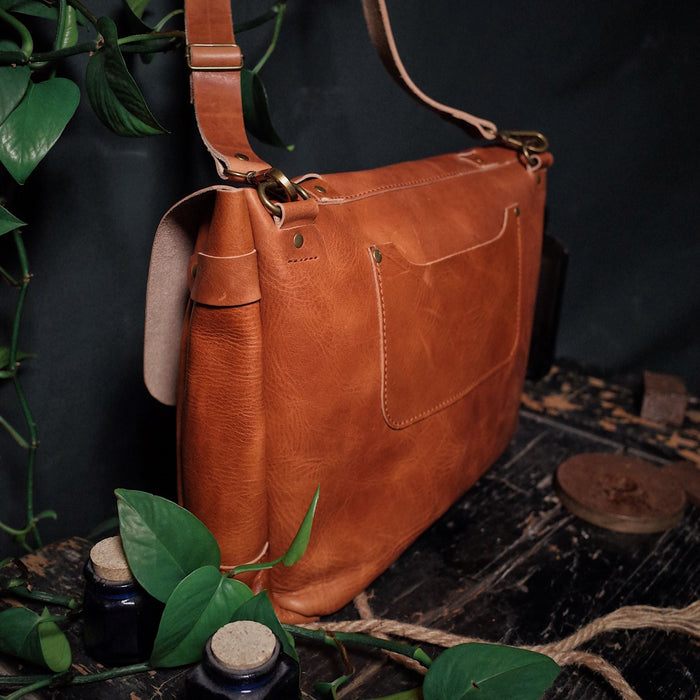 Sleek light brown leather shoulder bag perfect for work and travel
