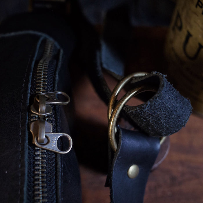 Oversized black leather moon bag for daily essentials
