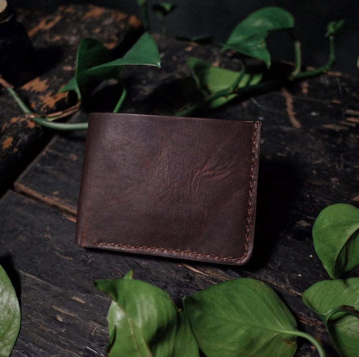 Compact coffee brown leather wallet with sleek, minimalist design
