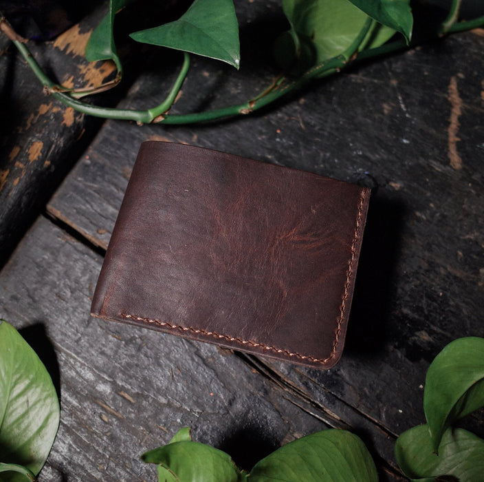 Hand-stitched chocolate leather bifold wallet with spacious interior
