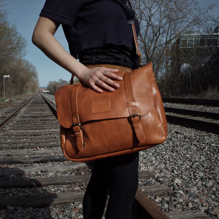 Customizable English tan leather messenger bag with premium stitching
