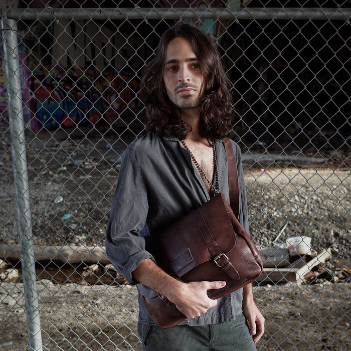 Spacious dark-brown shoulder bag with multiple compartments
