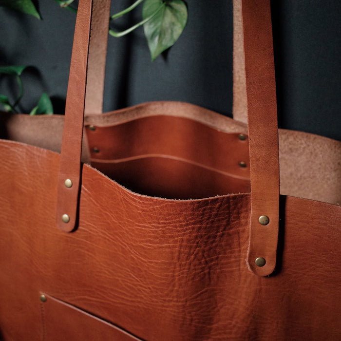 Sleek caramel leather satchel for commuting and travel

