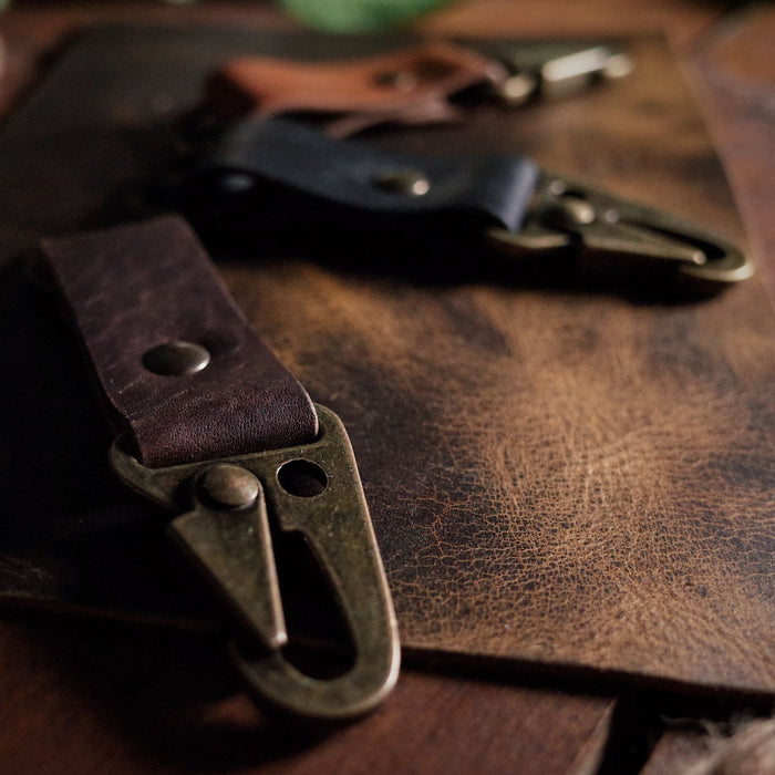 Locally crafted chocolate leather keyring with rugged military-style carabiner
