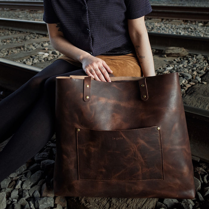 Sleek chocolate leather satchel for commuting and travel
