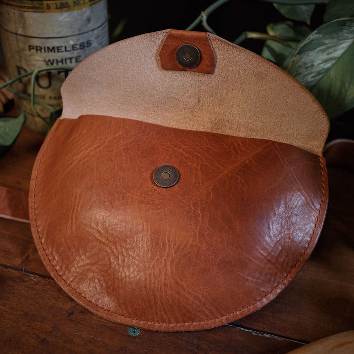 Handcrafted honey brown leather moon bag for stylish minimalism
