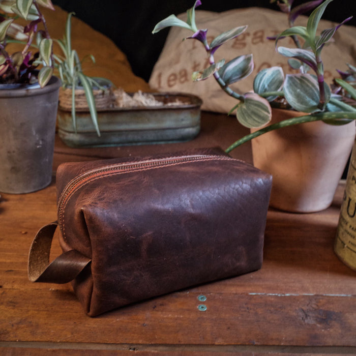 Handcrafted dark-brown leather toiletry bag with premium stitching
