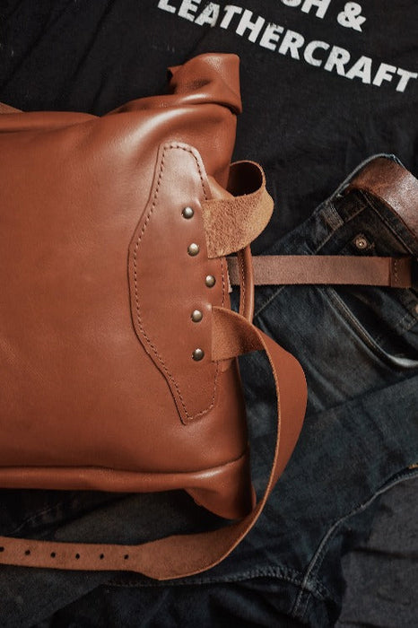 Artisanal honey brown leather roll-top backpack made in Canada
