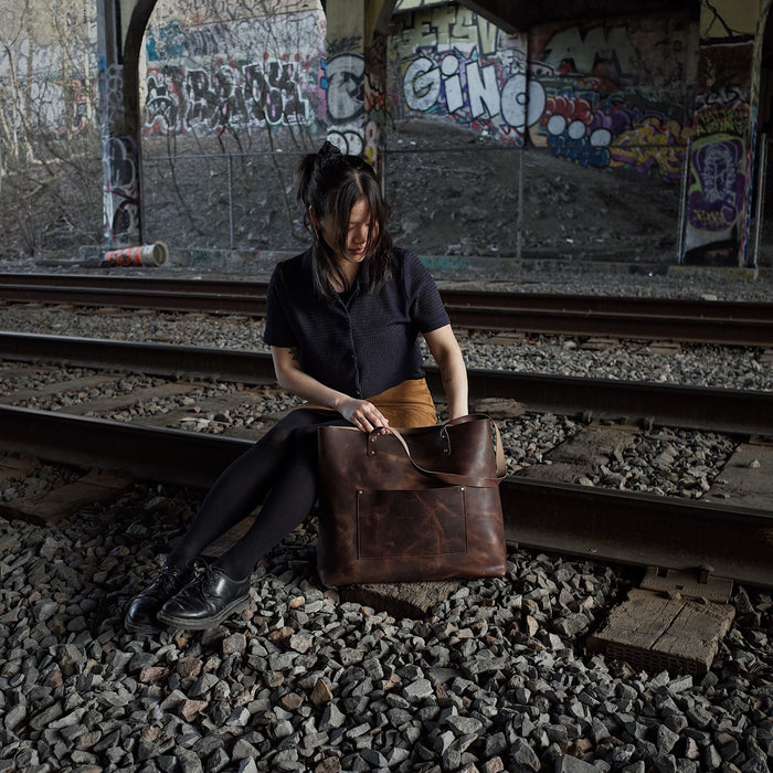 Hand-stitched chocolate leather carryall for daily use
