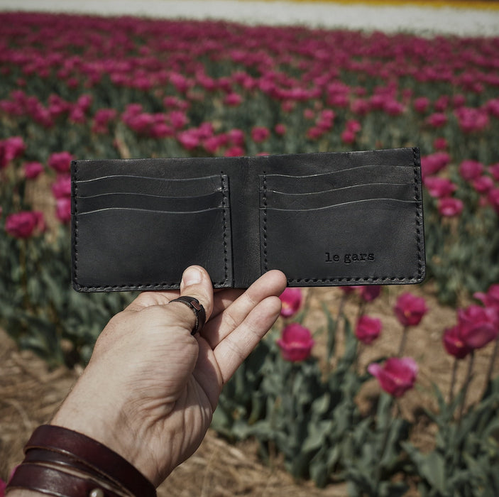 Artisanal black leather wallet with elegant, durable design
