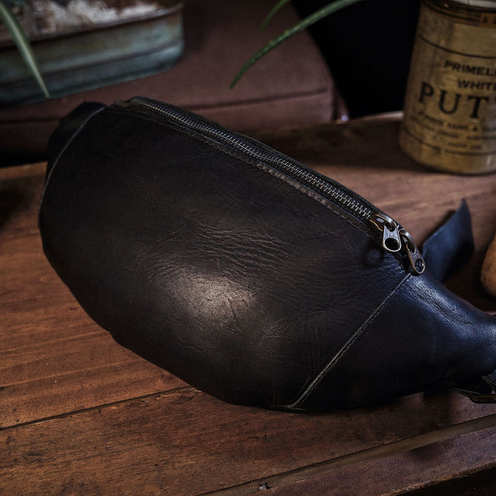 Handcrafted black leather belt bag for carrying extra items
