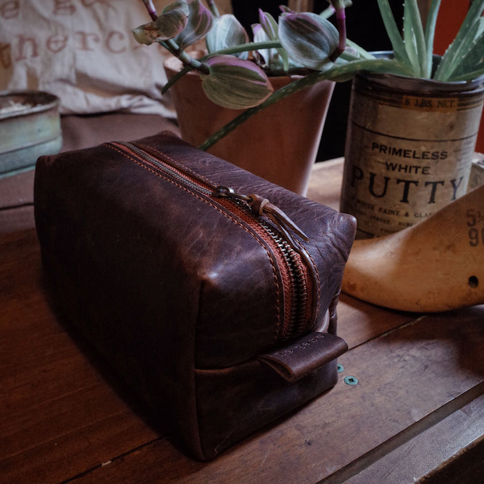 Artisanal mocha leather wash bag with sturdy metal zipper
