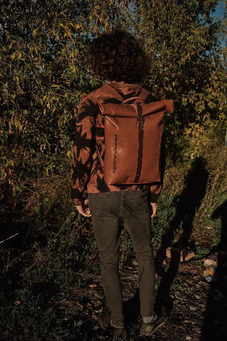 Spacious saddle tan leather roll-top backpack with G-hook for school and work
