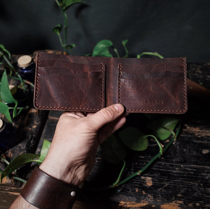 Compact chestnut leather wallet with sleek, minimalist style
