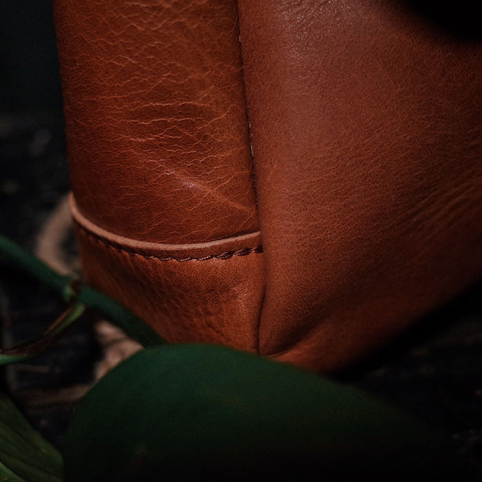 Classic caramel leather tote for carrying daily essentials
