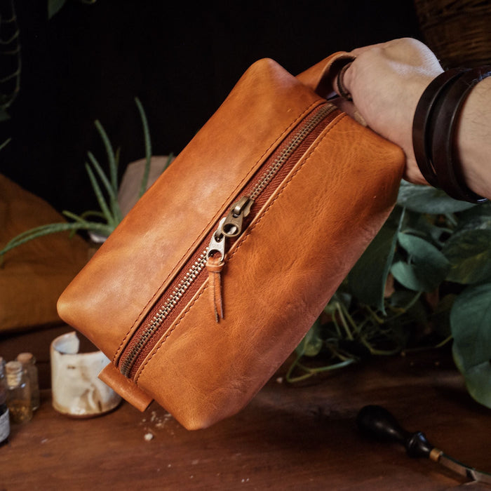 Stylish cognac leather wash bag with spacious compartments

