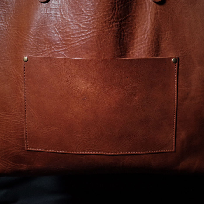 Artisanal caramel leather shoulder bag made from sustainable materials
