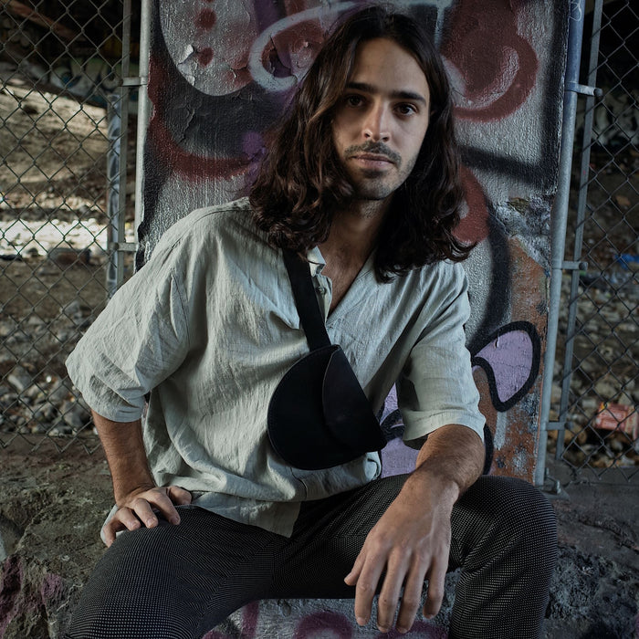 Compact black leather belt bag perfect for parties and gatherings
