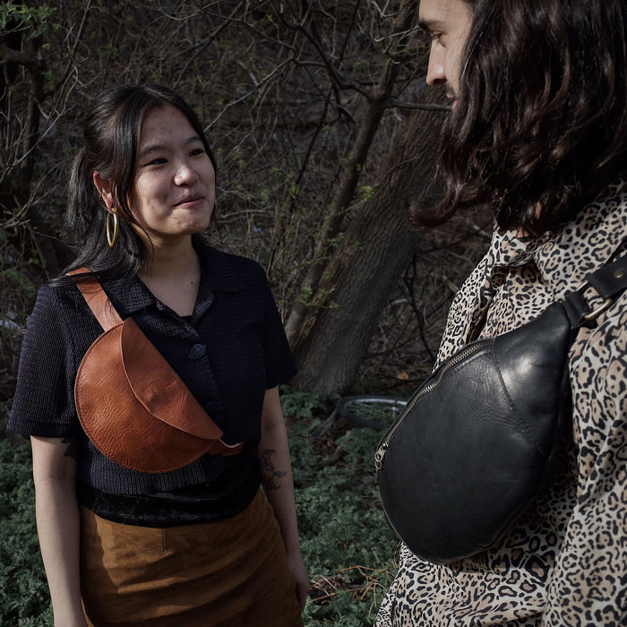 Full-grain English tan leather moon bag with adjustable strap
