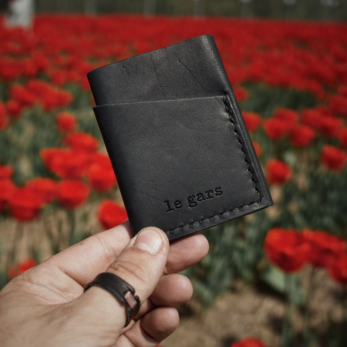 Genuine black leather cardholder designed for style and function
