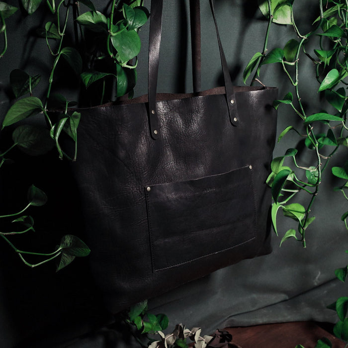 Genuine black leather tote bag designed for style and function
