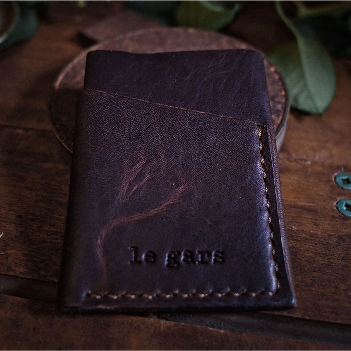 Genuine dark-brown leather cardholder designed for style and function

