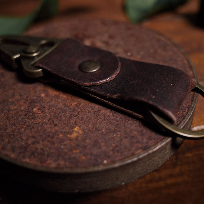 Durable chestnut leather carabiner key holder inspired by military style
