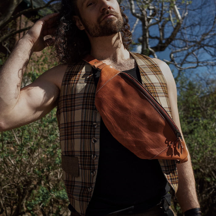 Spacious cognac leather belt bag with extra interior space
