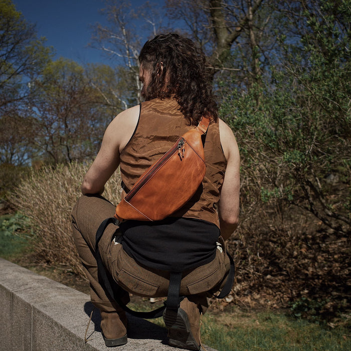 Spacious light brown leather fanny pack with smooth zipper
