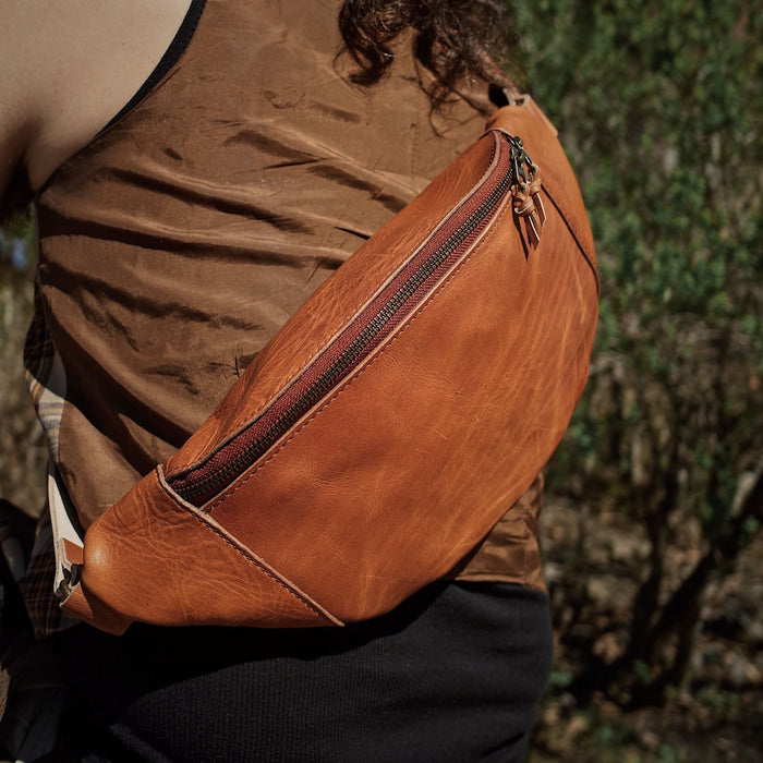Handcrafted English tan leather waist bag with durable zipper
