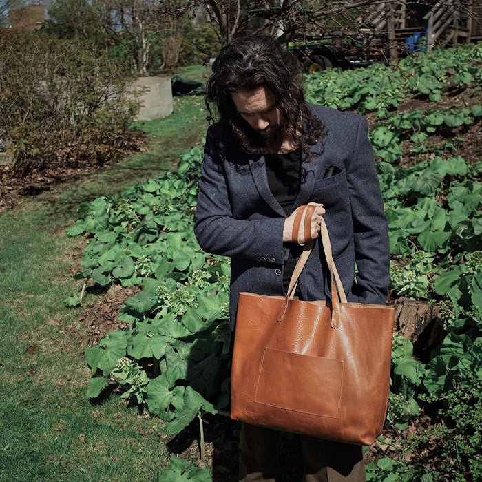 Handcrafted cognac leather carryall for minimalist fashion
