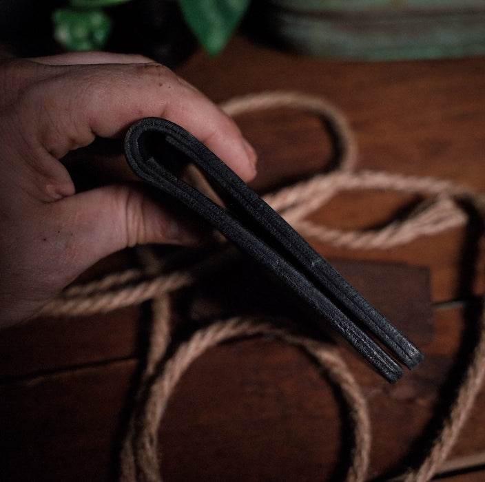 Full-grain black leather bifold wallet for everyday use
