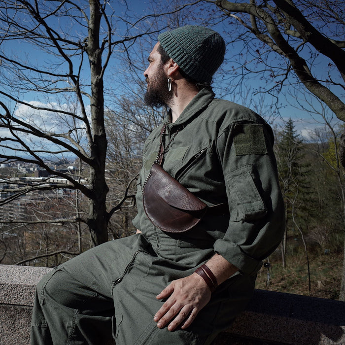 Full-grain chestnut leather belt bag for hands-free convenience
