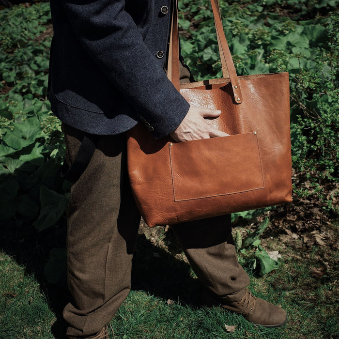 Spacious English tan leather handbag designed for durability and functionality
