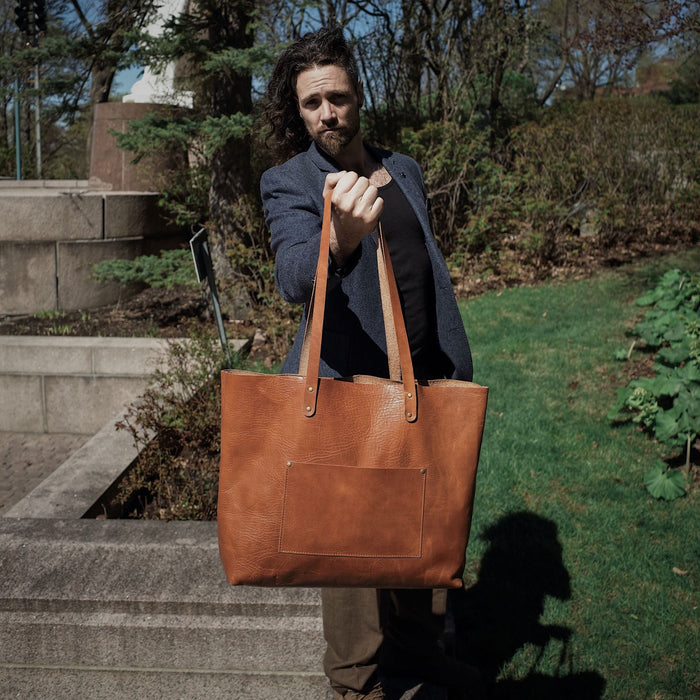 Sleek light brown leather carryall designed for function and fashion
