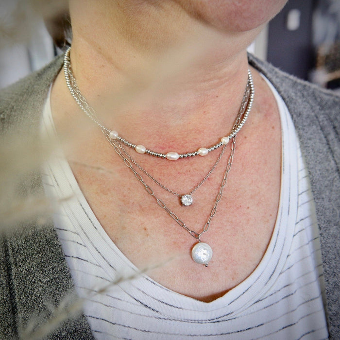 Collier pleine lune en acier et perle