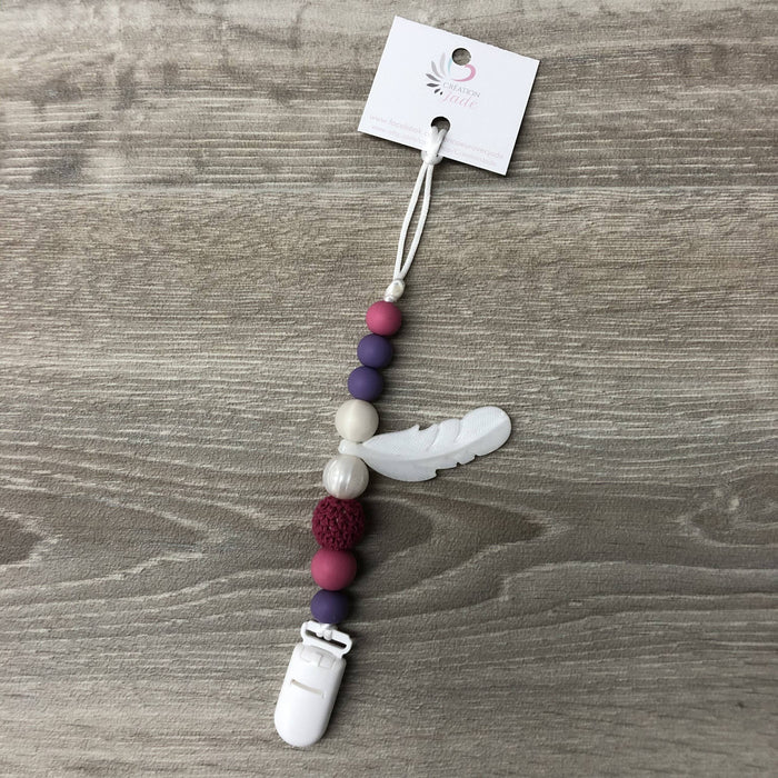 Attache-suce plume, lilas, fushia et perle