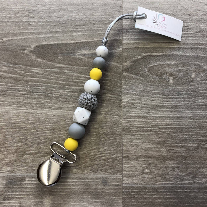 Attache-suce jaune, gris et marbre