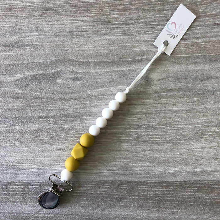 Attache-suce moutarde et blanc