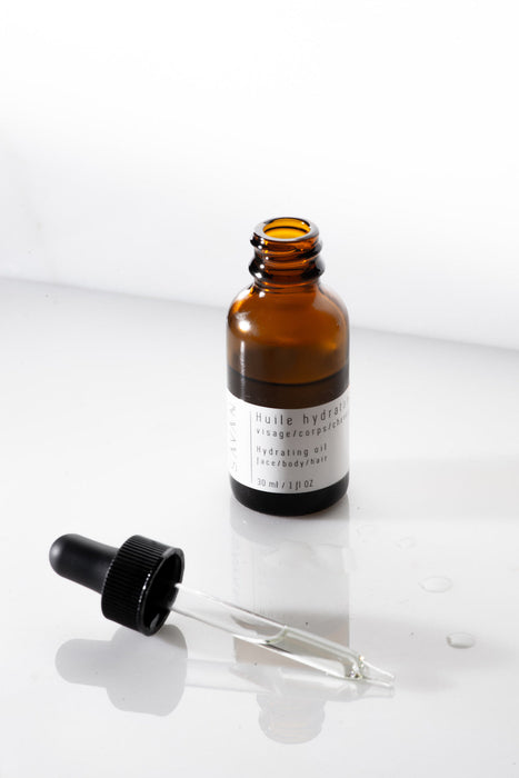 bouteille huile hydratante ouverte