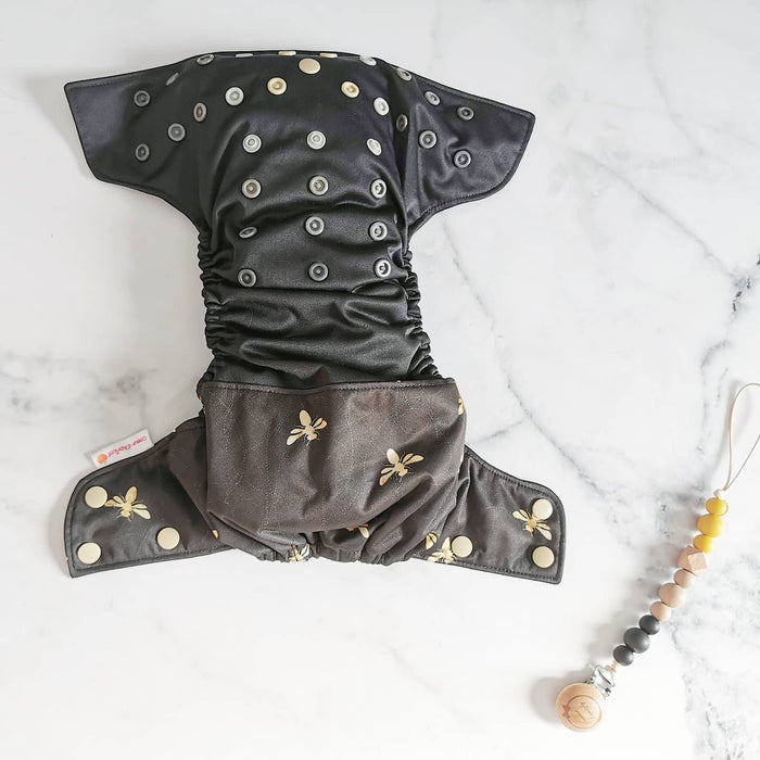 Duo couche lavable et attache suce abeilles