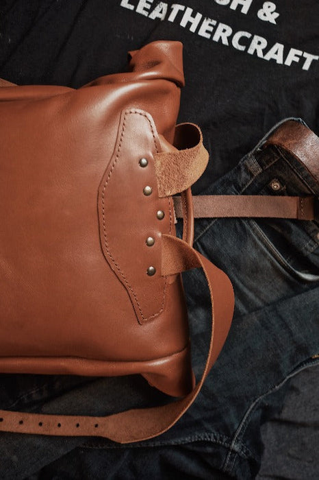 minimalist light brown leather rolltop backpack