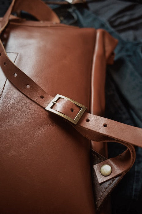 minimalist light brown leather rolltop backpack